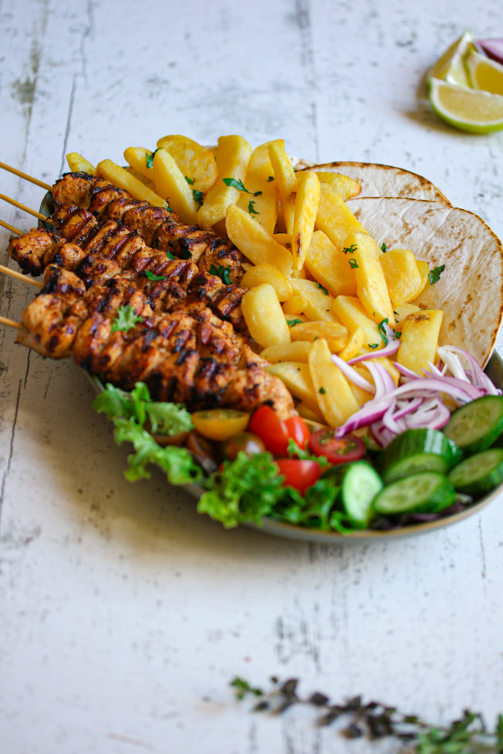 Greek Chicken Souvlaki Skewers with Oven Chips and Crunchy Salad